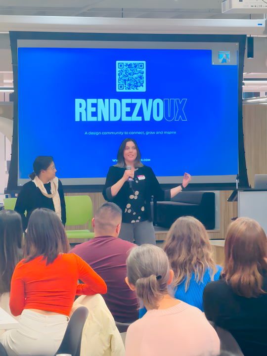 Untitled Amy presenting Rendezvoux to a group of community members.
